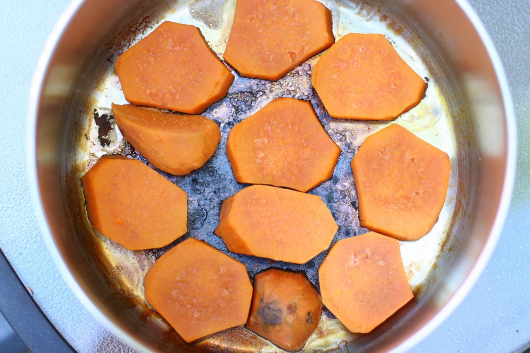 Burnt sweet potatoes in a pan.