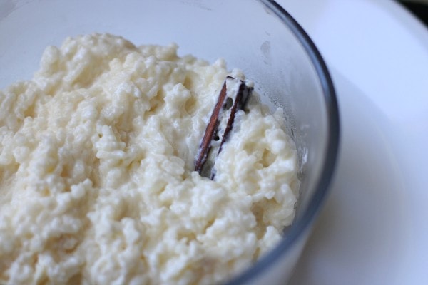 A glass bowl of rice pudding.