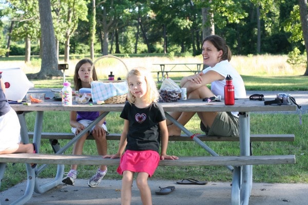 Kristen and girls at a picnic table.