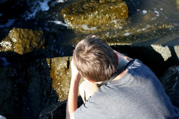 A boy using a camera.