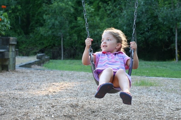 Zoe on a swing.
