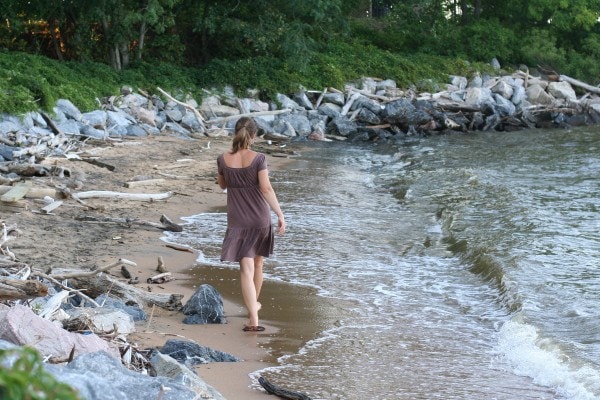 Kristen walking on a beach.