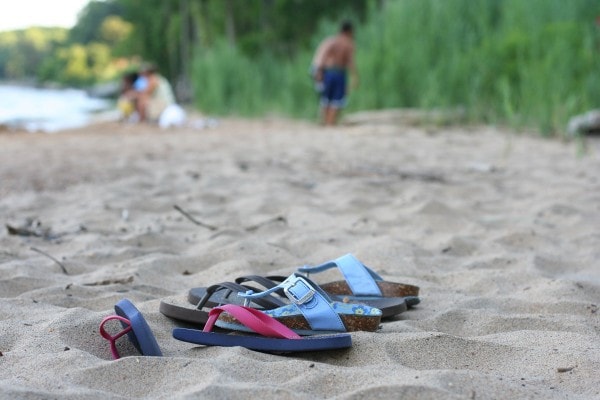 Children's shoes in the sand.