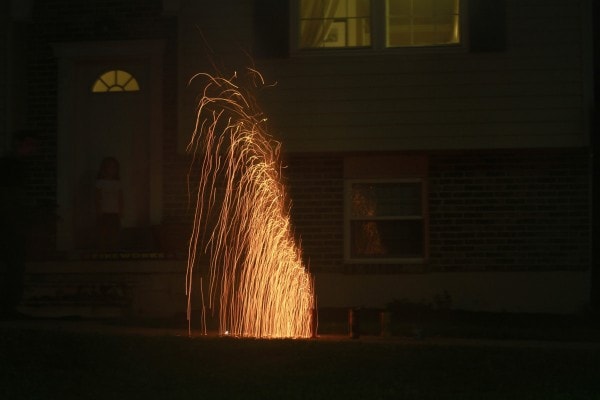 A golden ground-based firework.