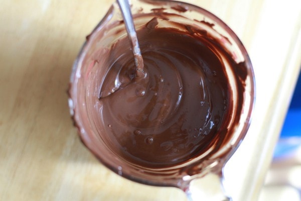 Melted chocolate in a measuring cup.
