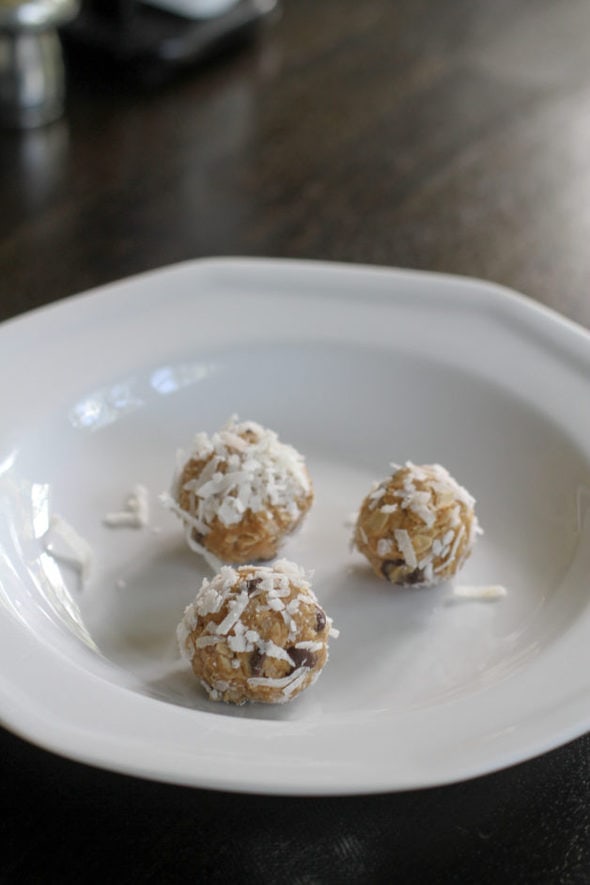 Three peanut butter energy balls, rolled in coconut.