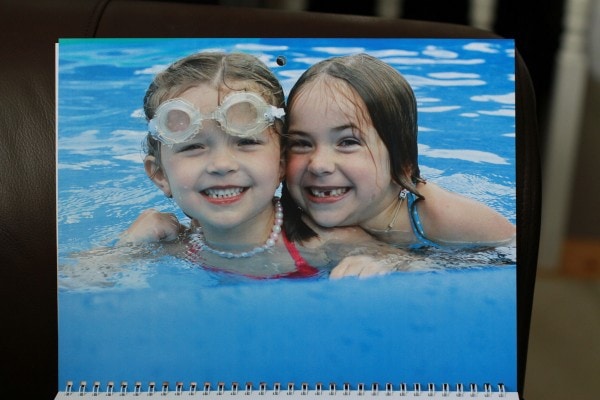 Two girls in a swimming pool.