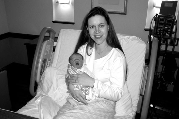 Kristen holding newborn Sonia.