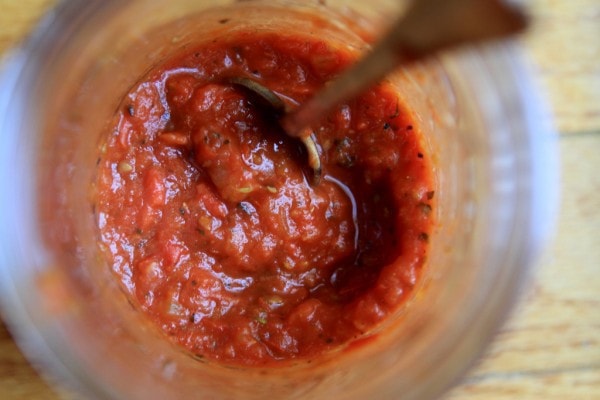 Tomato sauce in a glass Mason jar.