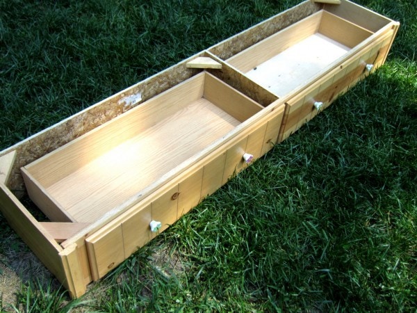 Under bed drawers for a twin bed, sitting in the grass.