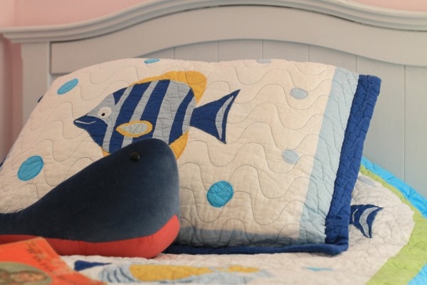 A quilted fish pillow sham.