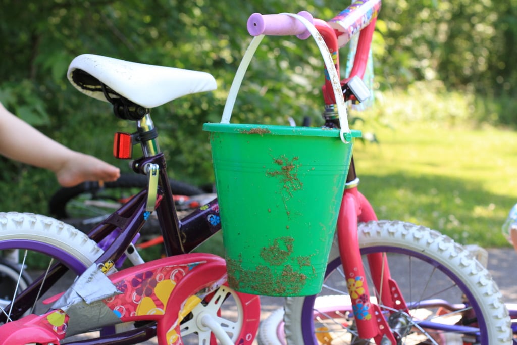 Two little girl bikes on a road.