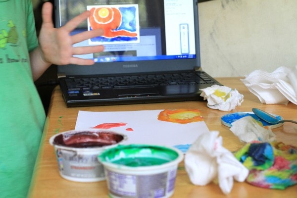 A child using finger paint.