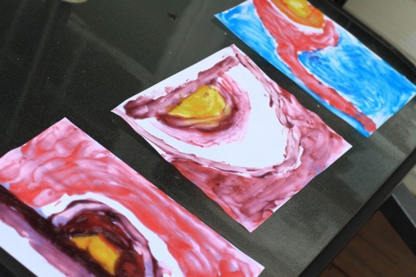 Watercolor paintings drying in the sun.
