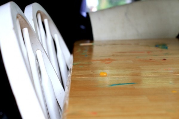 A table with finger paint on it.