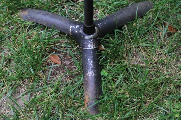 A worn metal music stand.