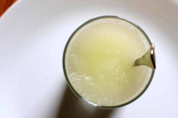 Homemade lemon ice in a glass.