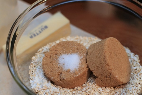 Brown sugar, salt, and oats in a glass bowl.