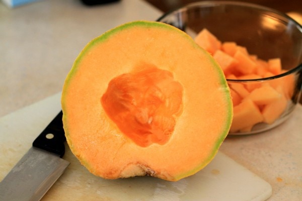 A cut-opne half of a cantaloupe melon.
