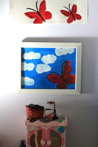 children's butterfly paintings on wall.