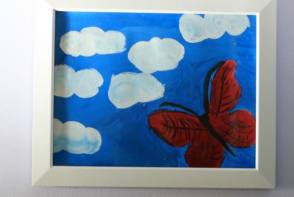 frame kid's painting of butterfly.