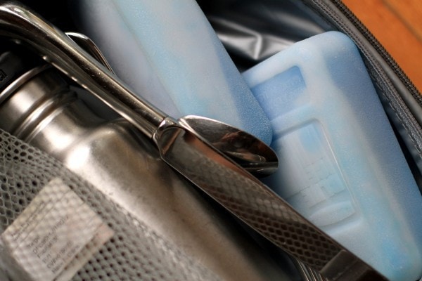 Ice packs and a water bottle in a lunch bag.