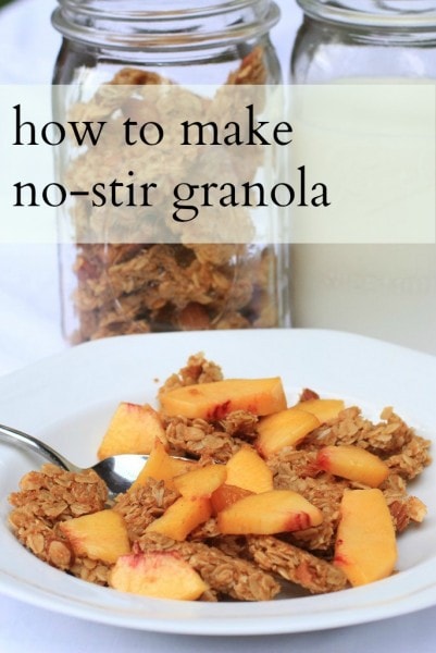 A bowl of granola topped with peaches.