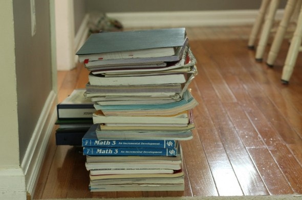 Stacks of used schoolbooks on the floor.
