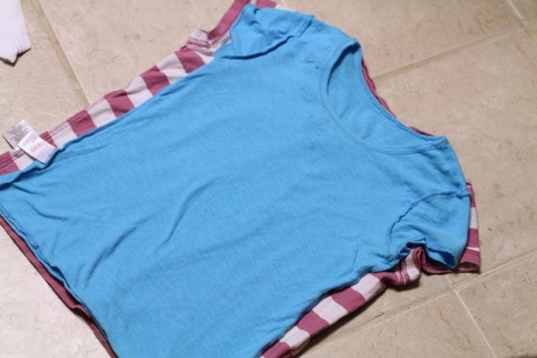 Two shirts stacked on top of each other.