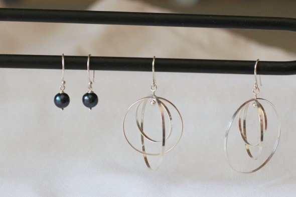Two pairs of dangly earrings.