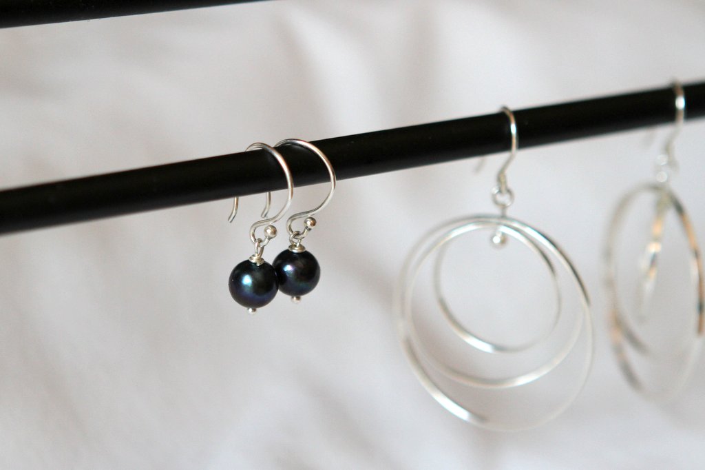 Two pairs of dangle earrings