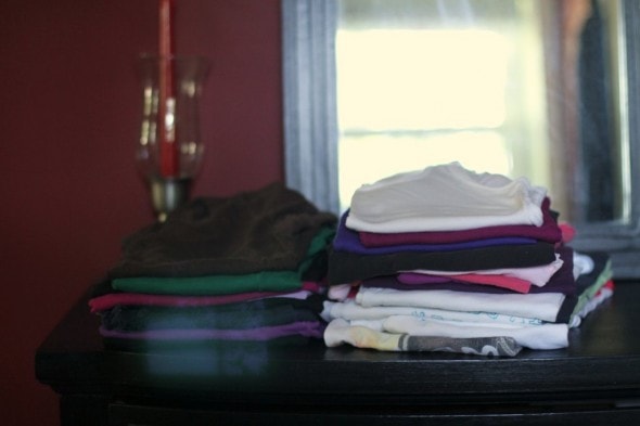Folded clothes on a dresser.