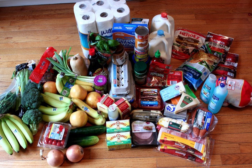 Groceries from Aldi, arranged on a wood surface.