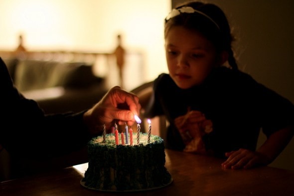 lighting candles on an ice cream cake
