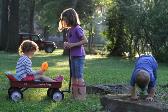 Children playing outside on a summer evening.