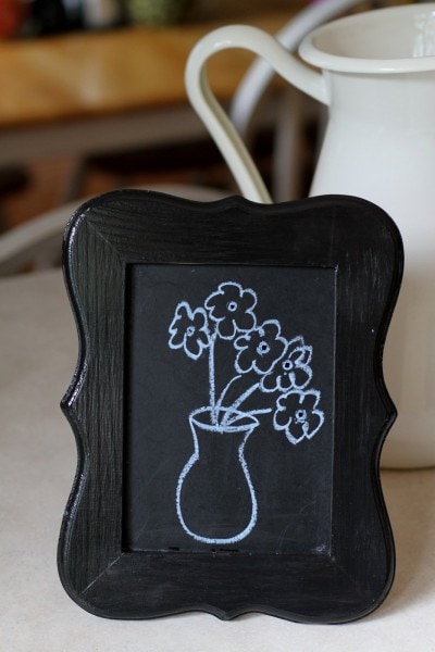 flowers on chalkboard frame