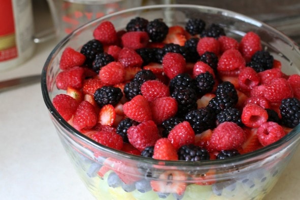 A big glass bowl of fruit salad.