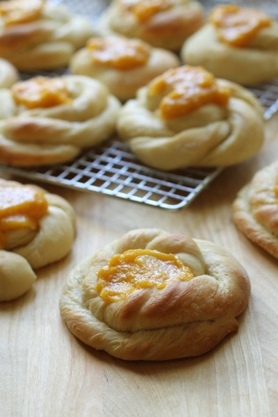 Apricot swirl sweet rolls cooling on a wire rack.