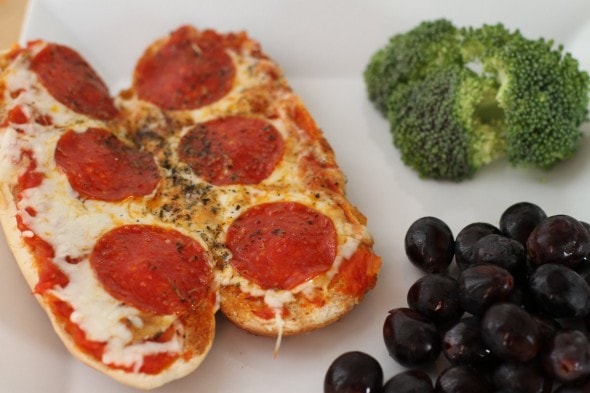 Pizza subs on a white plate.