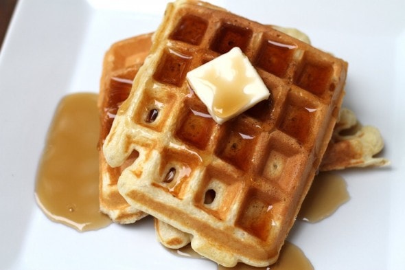 buttermilk waffles on a white plate.