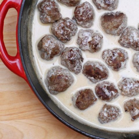 Swedish meatballs in a red skillet.