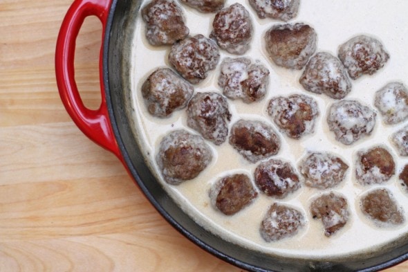 Swedish meatballs in a red skillet.