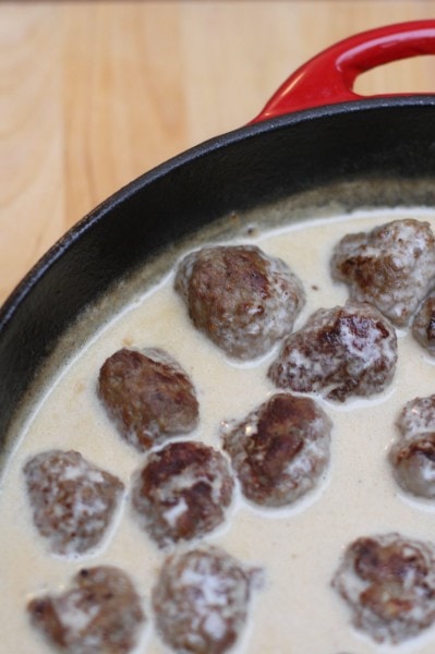 Swedish meatballs in a red skillet.
