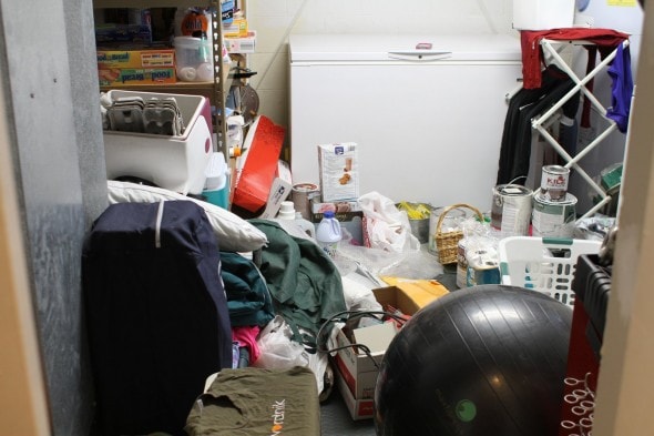 A cluttered, messy laundry room.