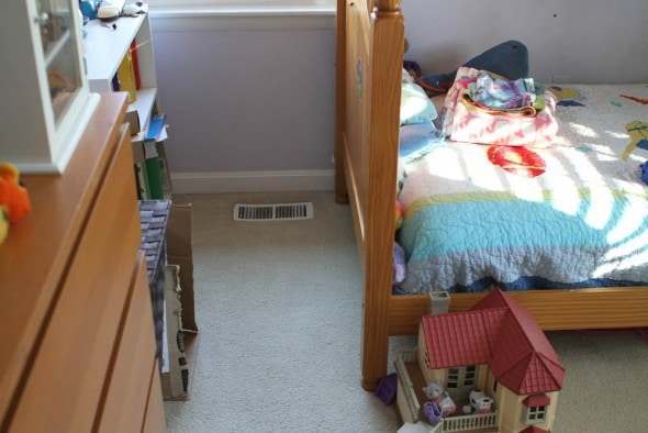 A view of a child's bed and dresser