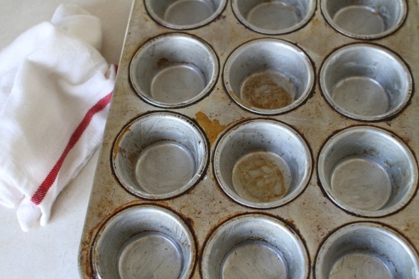 grease muffin tin with butter