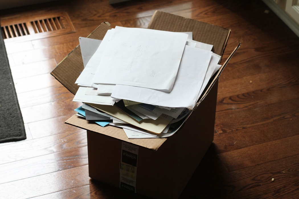 Papers in a cardboard box.