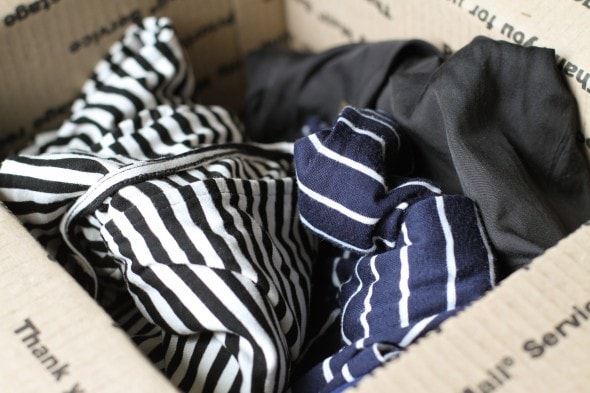 A box of secondhand clothing.