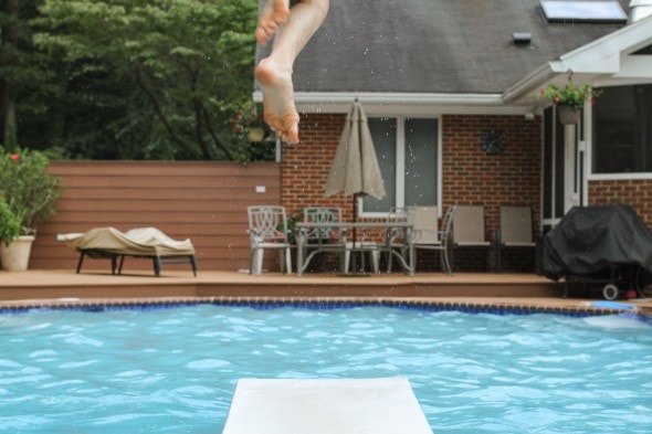 A view of a backyard swimming pool.