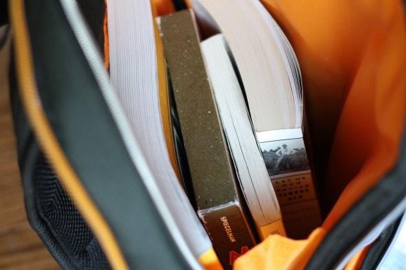 A backpack filled with schoolbooks.
